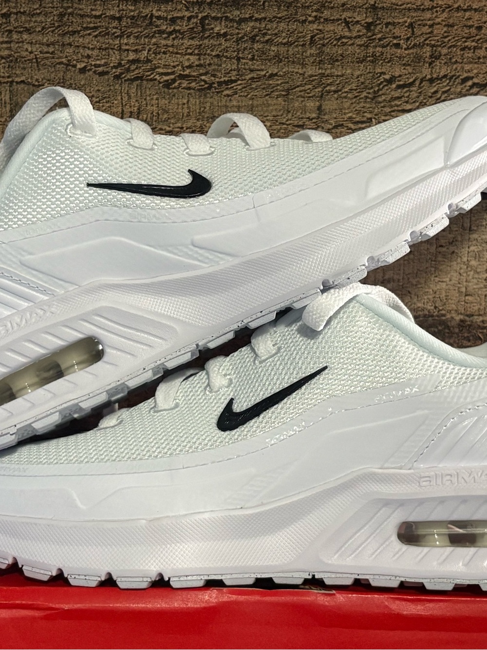 Nike White Sneakers with Black Swoosh men’s 7.5 and women’s 8.5